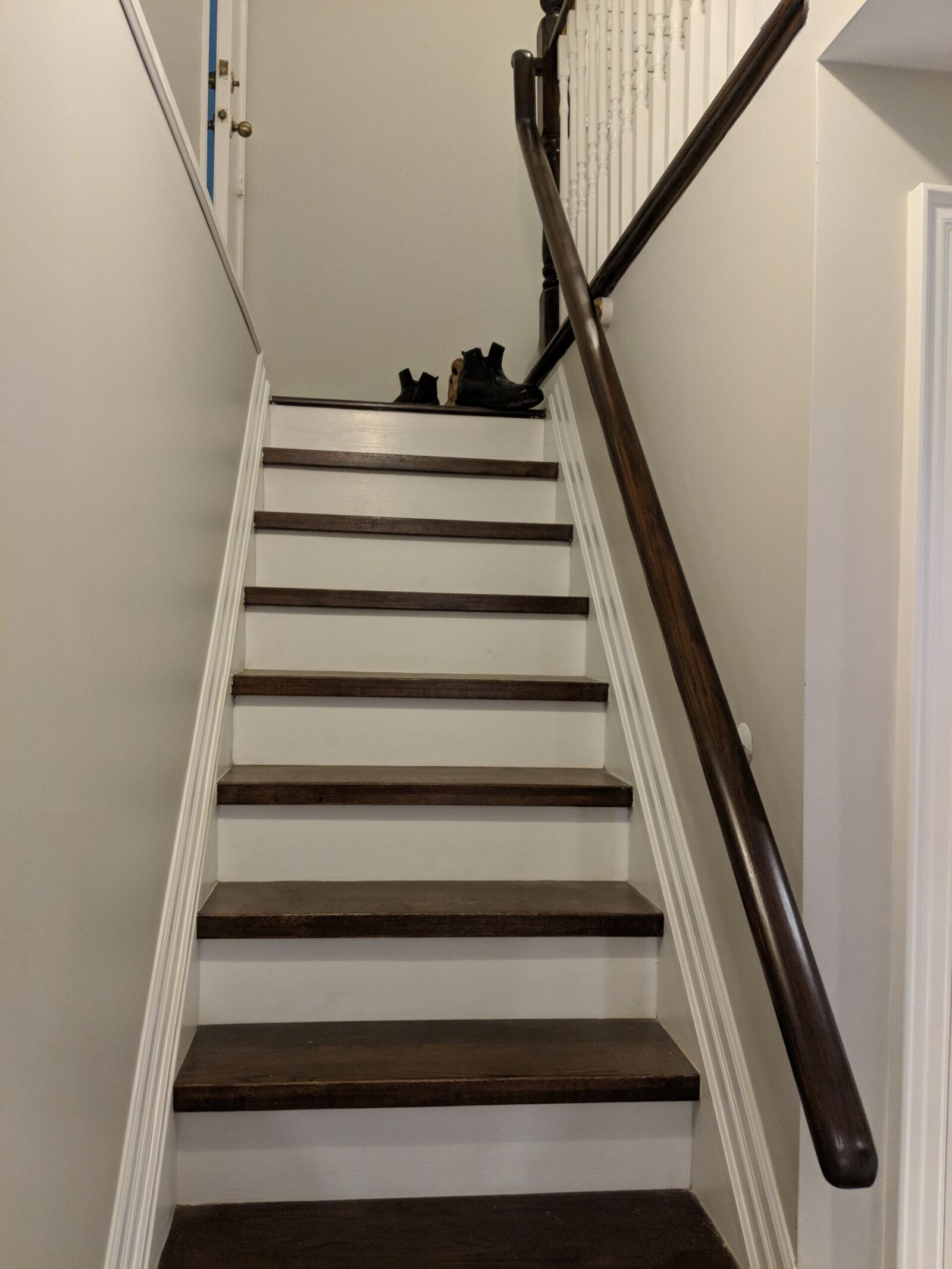 Vaughan finished basement: staircase with dark treads and a handrail