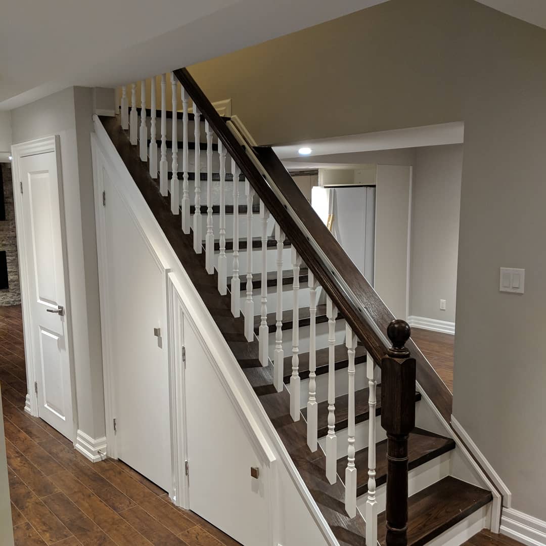 Vaughan finished basement: staircase with white balusters and dark handrail