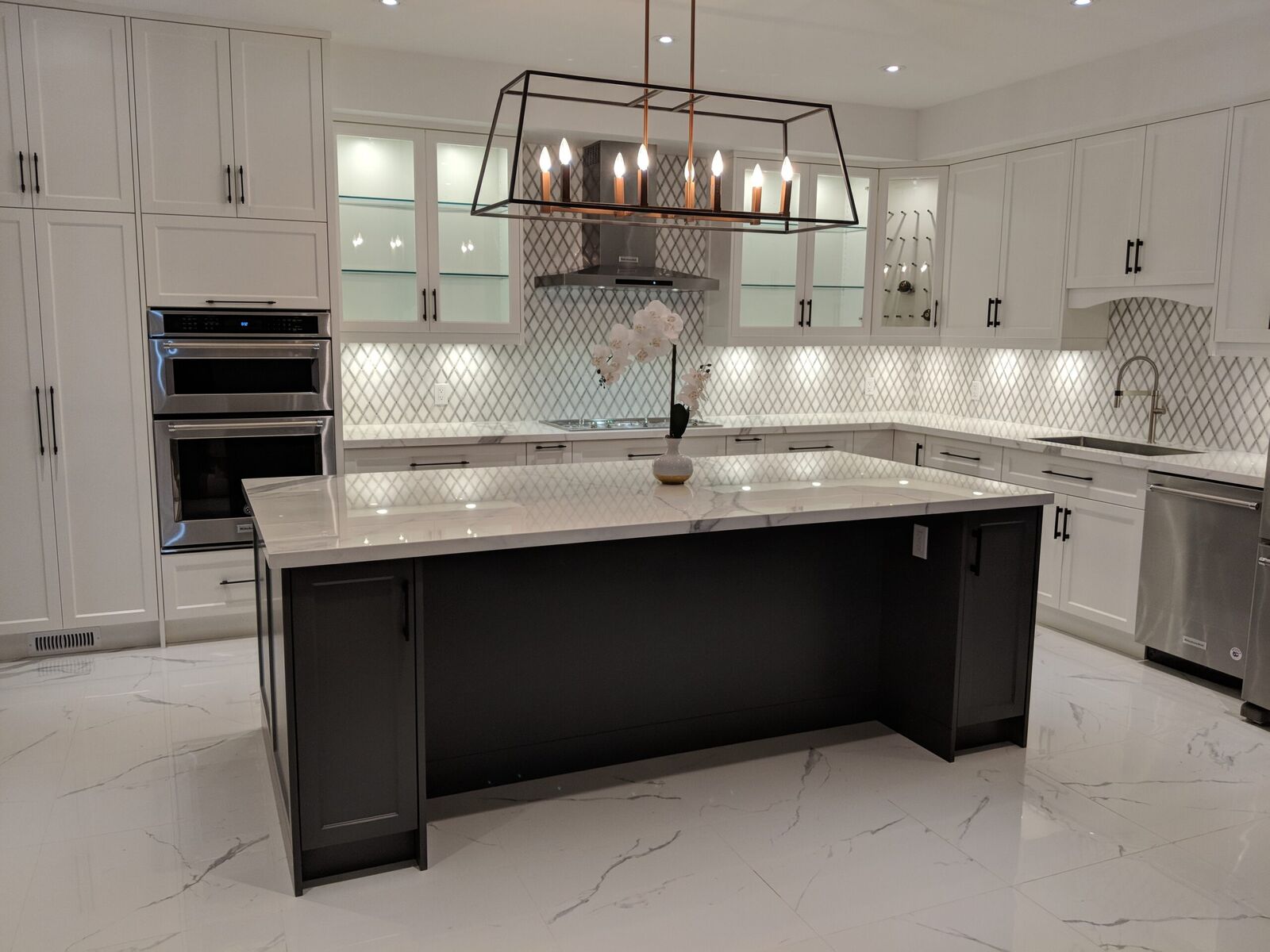Brampton white kitchen: full view with two islands, white shaker cabinetry and pendant lights