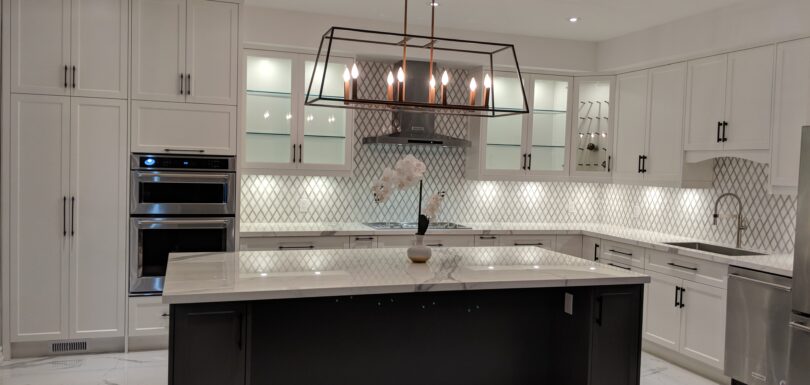 Brampton white kitchen: second angle with the dark island and white cabinetry
