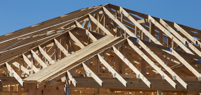 A house under construction with wooden framing