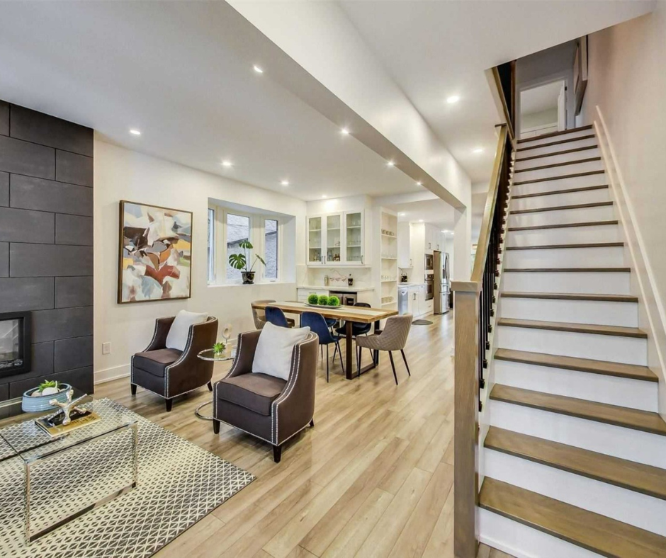Arlington 2026 renovation: Open-concept living room with a staircase