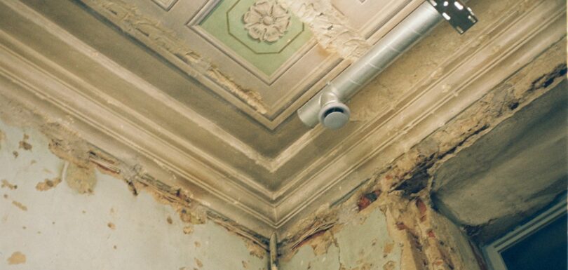 Ceiling with peeling paint from water damage