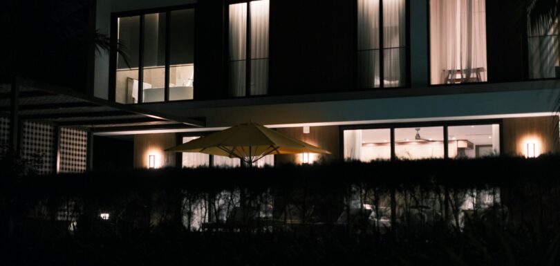 Modern luxury home lit up at night