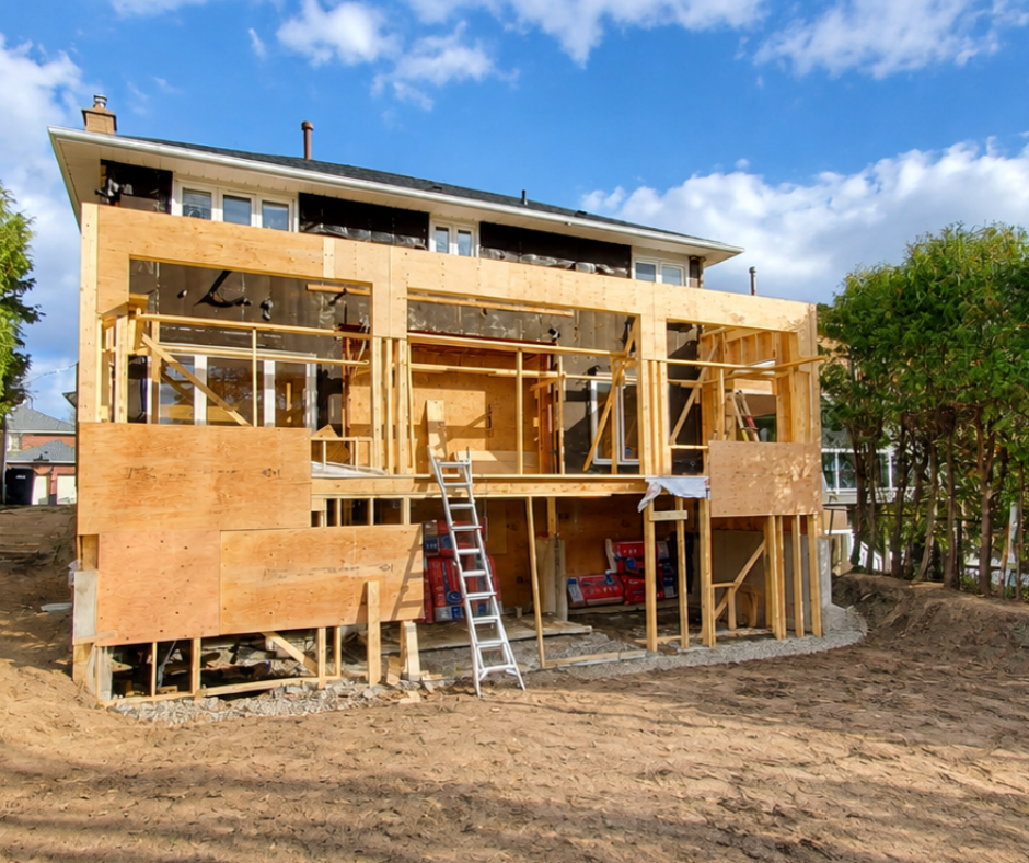 Rear home addition under construction, framing in progress