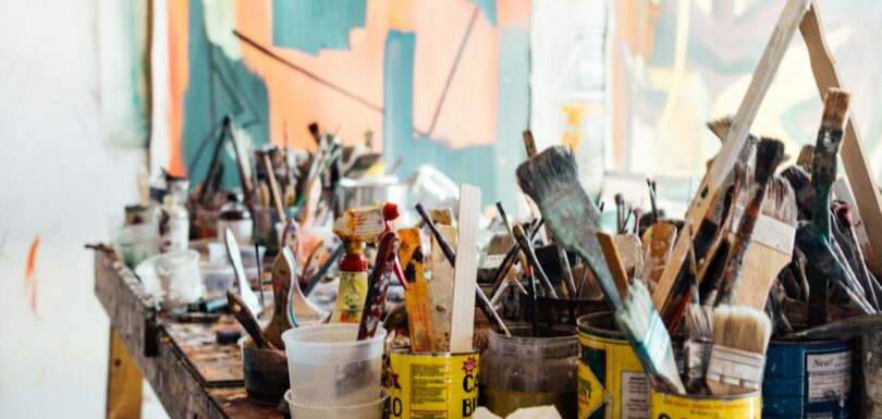 Paint brush on a wooden table